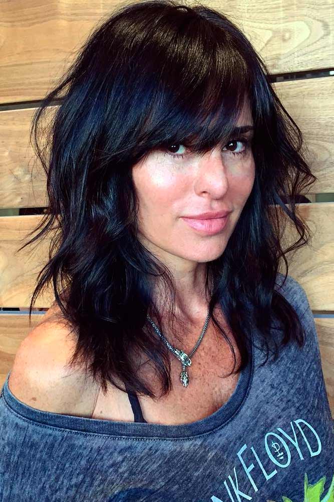 medium length wavy haircuts with bangs