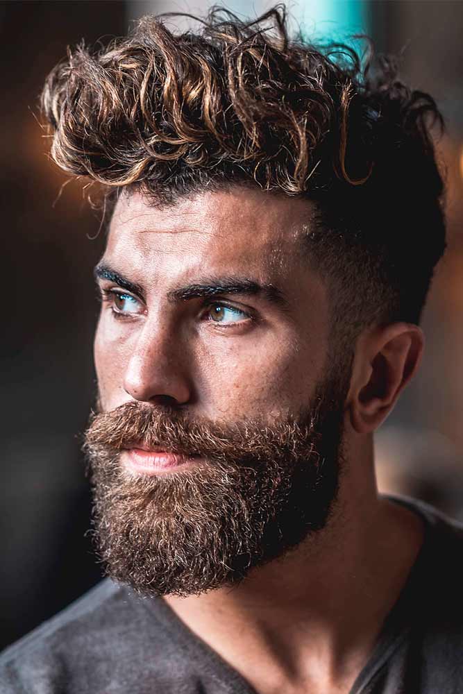 best mens hairstyles long layered brown blonde balayage disconnected undercut long bang curly beard