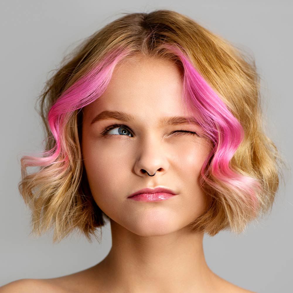 Curly Blonde Bob Haircut With Pink Highlights