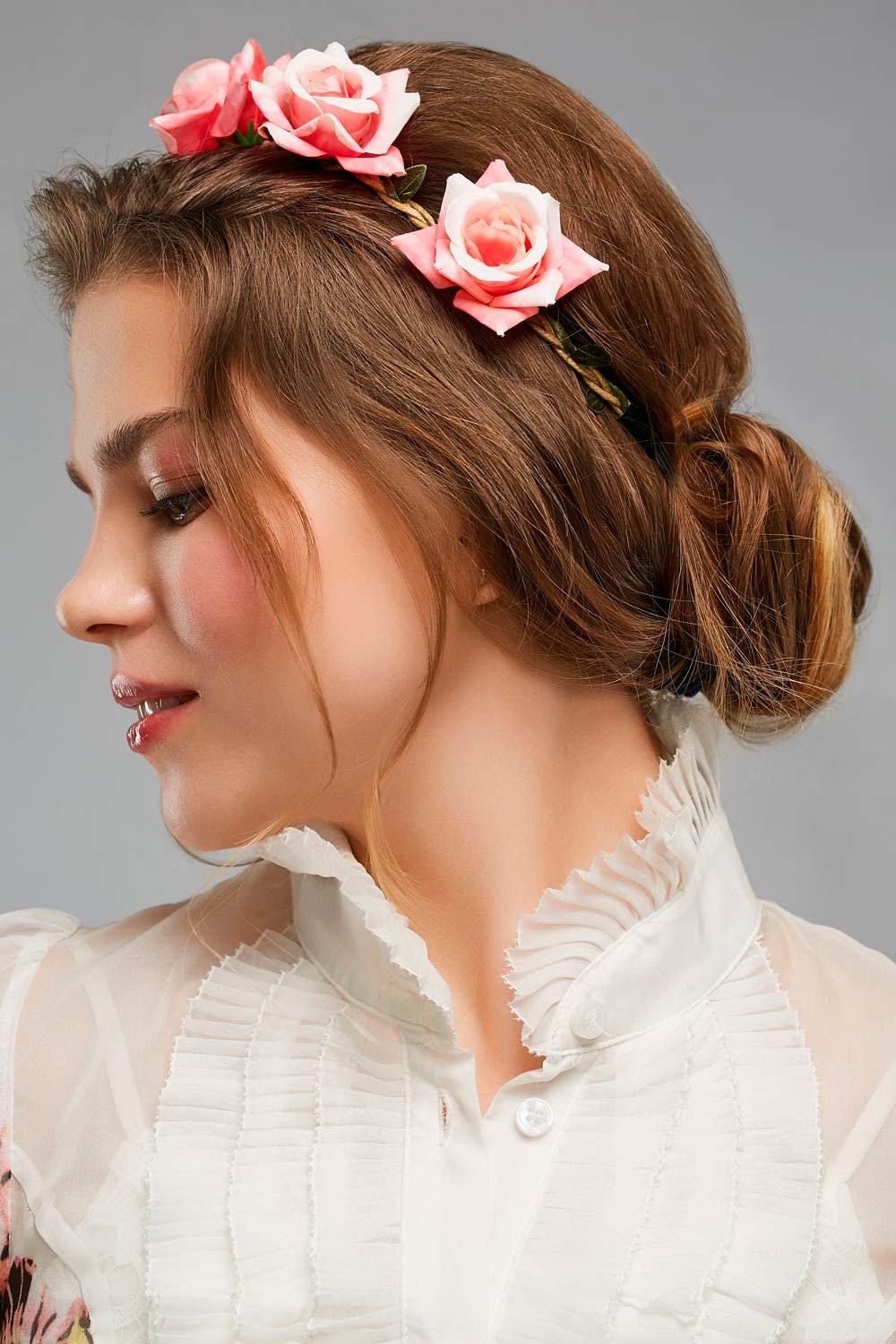 Accessorized With Flower Hairstyle With Bun