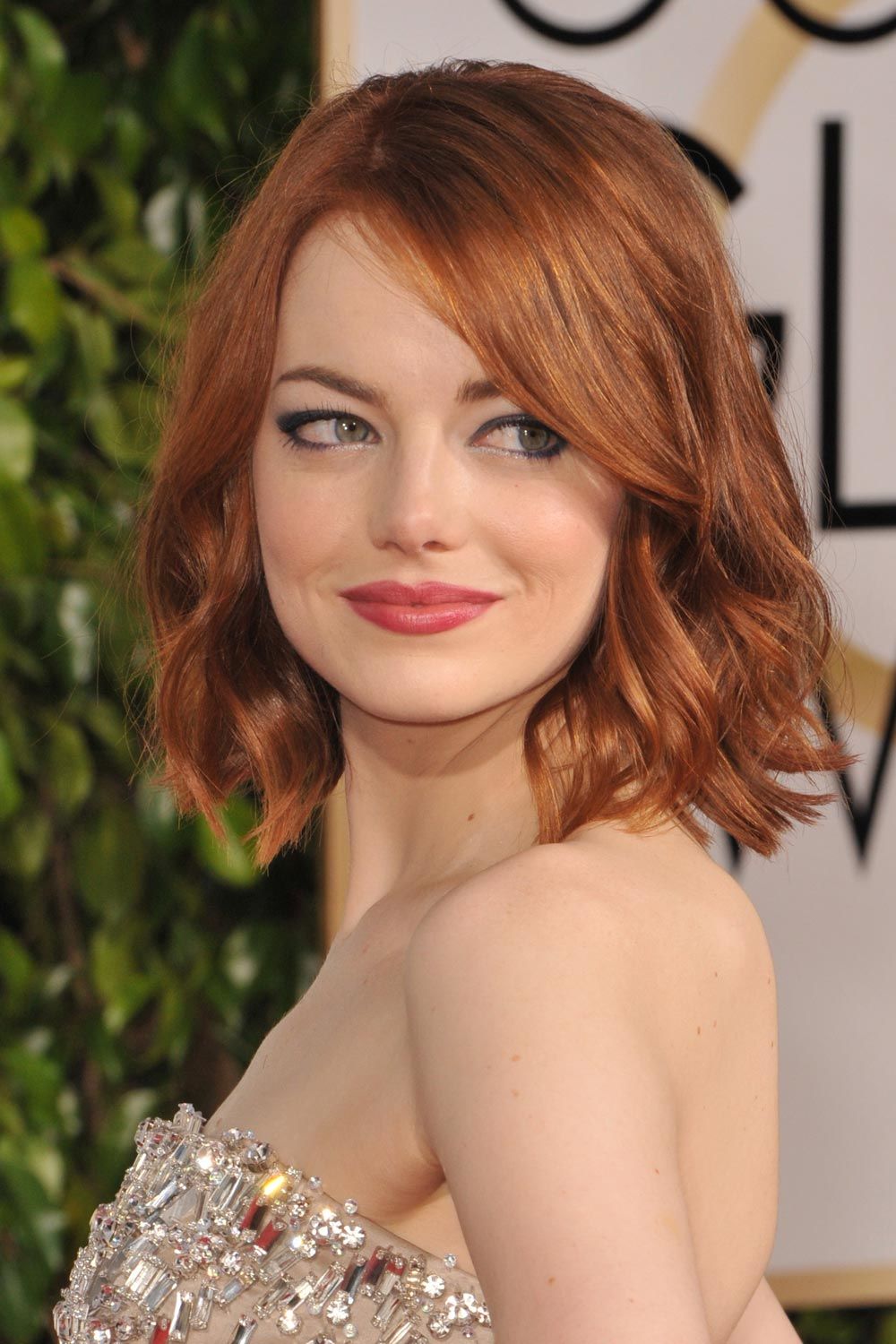 Emma Stone With Red Wavy Bob And Side Bangs