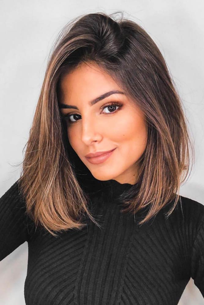 Image of Straight layered hair with a side part for oval face