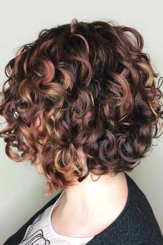 Medium Curly Bob With Red Highlights #curlybob #haircuts #bobhaircuts