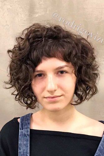 Short Curly Bob With Blunt Baby Bangs #curlybob #haircuts #bobhaircuts #curlyhairstyles #shortbob