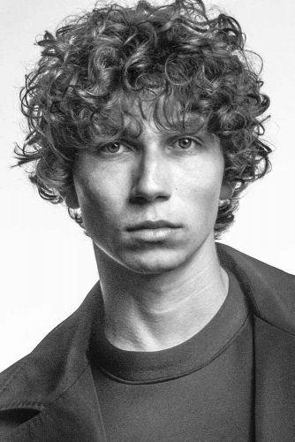 How To Get And Style Curly Hair Men Like To Sport