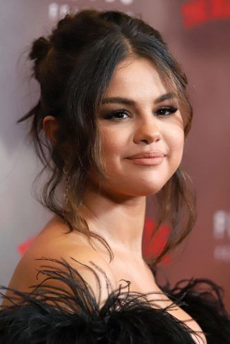 Updo With Center Parted Bangs #selenagomez #selenagomezhairstyles #hairstyles #haircuts
