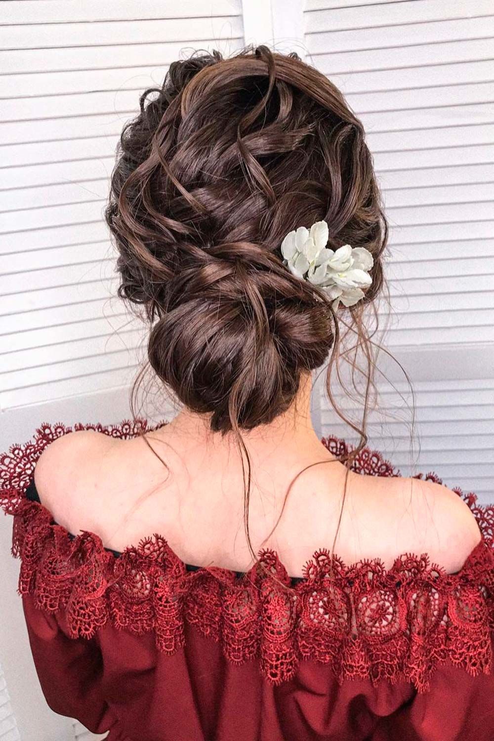 Low Messy Bun With Flowers 