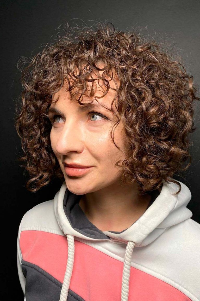 Implement Curly Bangs In Your Outlook and Enjoy The Flattering Effect
