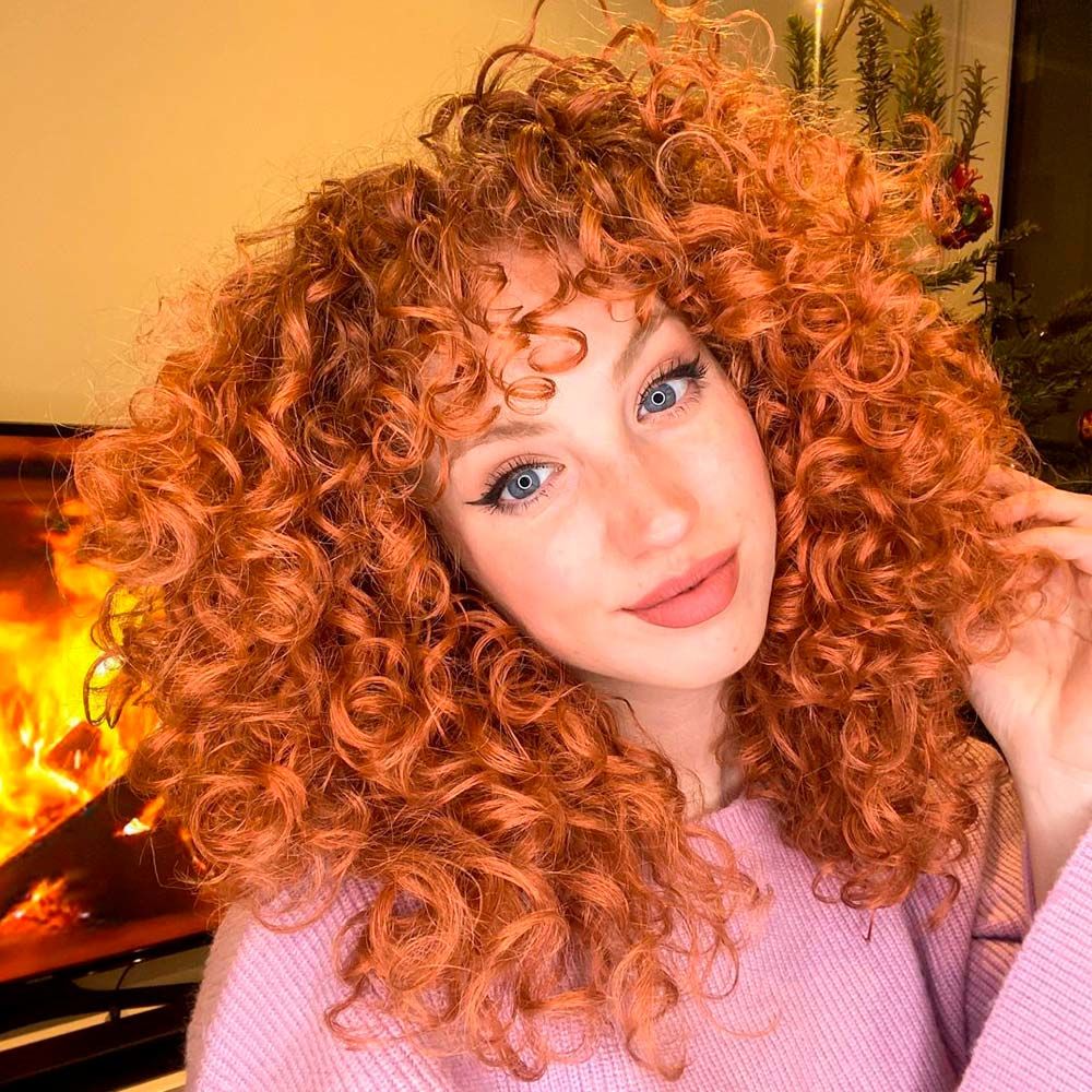 Implement Curly Bangs In Your Outlook and Enjoy The Flattering Effect