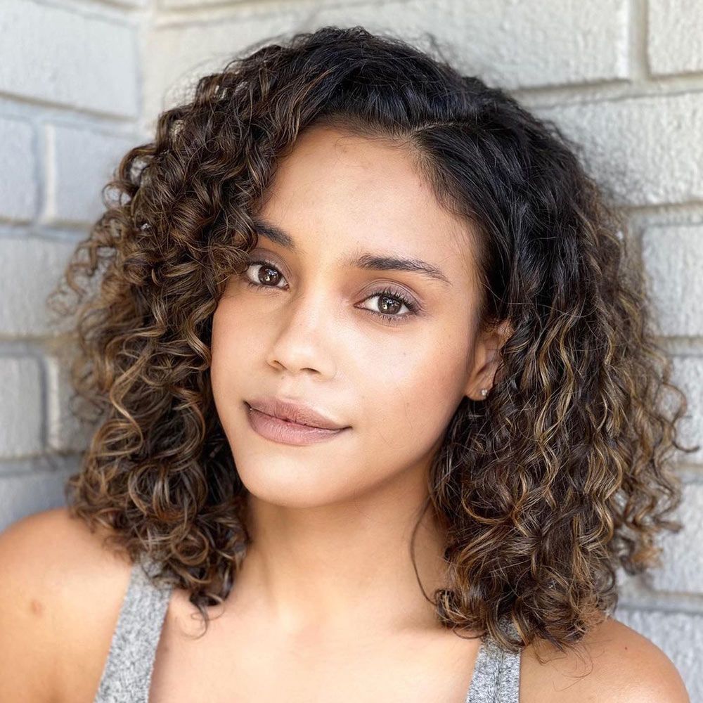 42 Best Short Curly Hair with Bangs to Try This Year