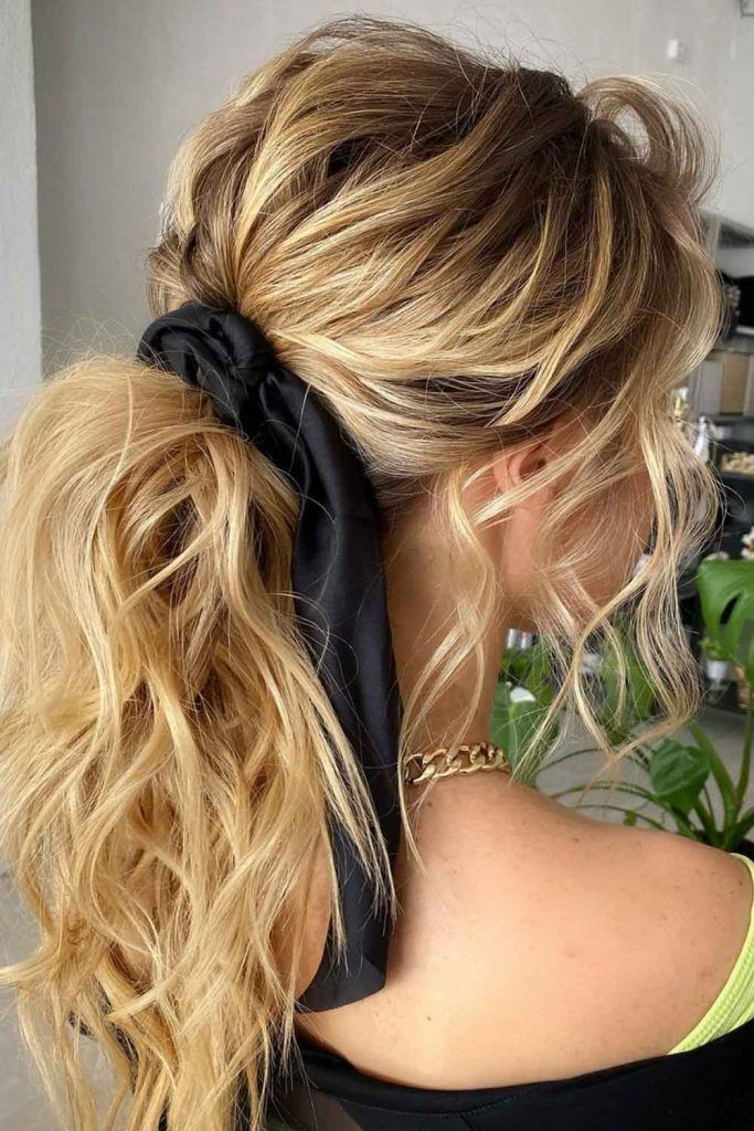 Low Wavy Ponytail And Side Bangs