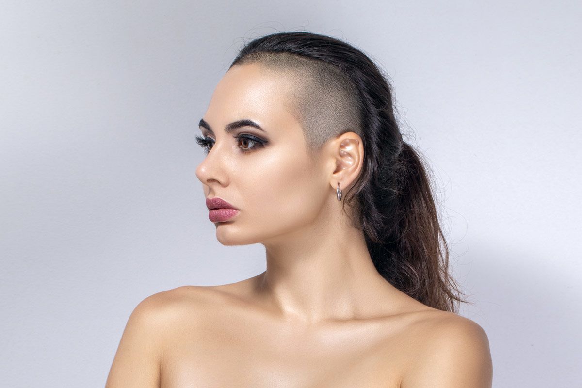 Beautiful young woman with unusual hairstyle. It has half the hair is... -  Stock Image - Everypixel