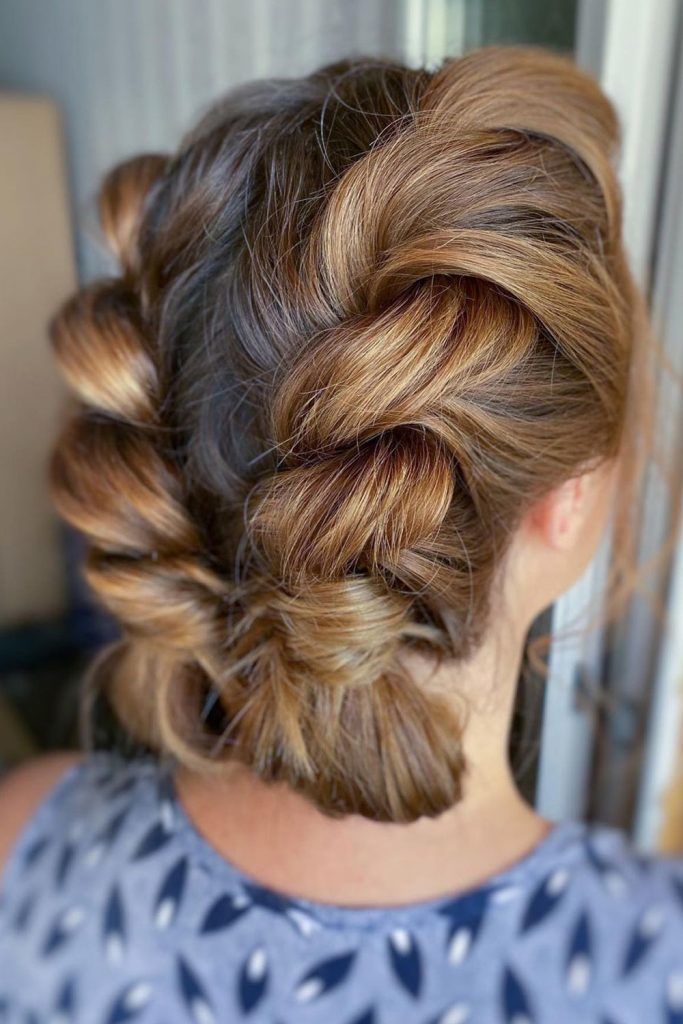 Image of Twisted bun volleyball hairstyle for short hair