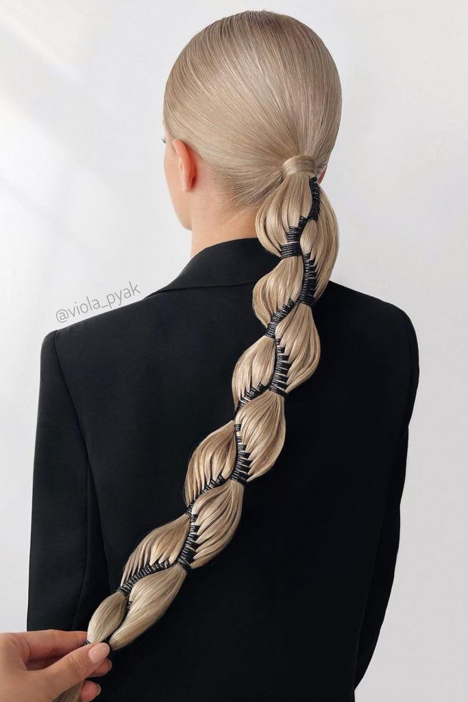 A low ponytail can look fun and unusual when you incorporate various hair accessories into it.