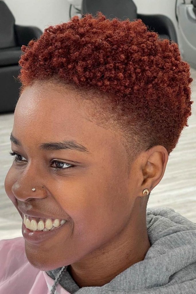 An auburn, which is basically reddish brown, hair color works wonders for dark skin