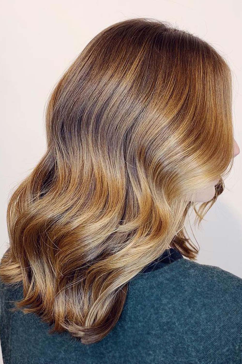 Gorgeous flowing waves will make these caramel balayage tones look like silky ribbons of the real caramel