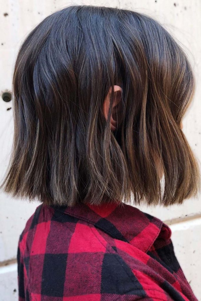 If you are not a fan of tomboy short fluffy haircuts, you can always opt for a medium length androgynous haircut, such as a bob.