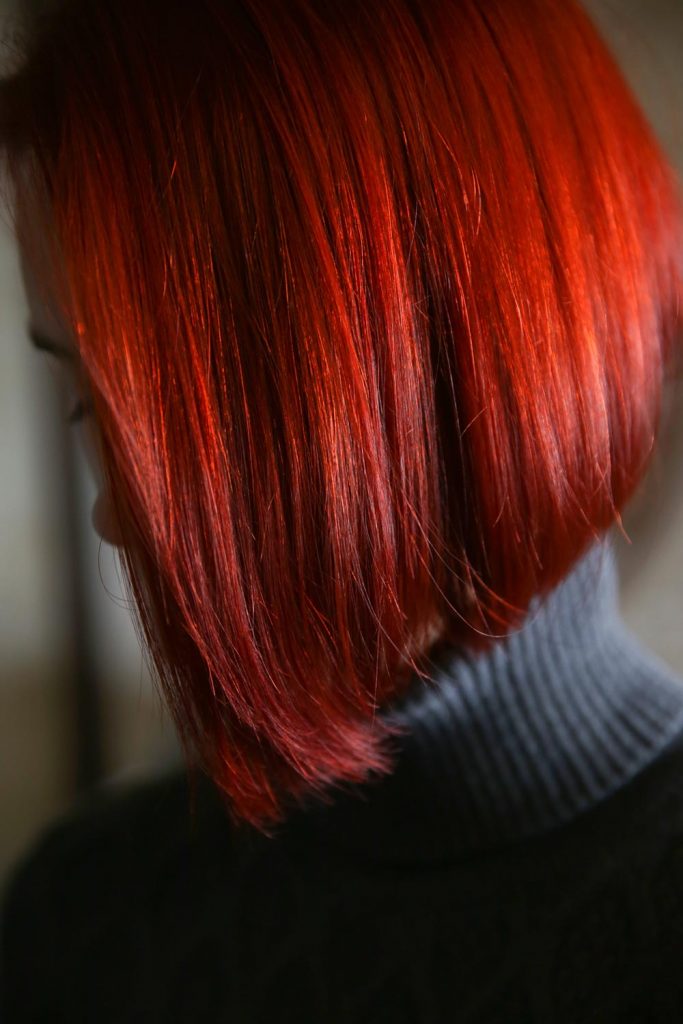 When choosing the most suitable red hair color, you may opt for the shade that has an opposite or the same undertone as yours