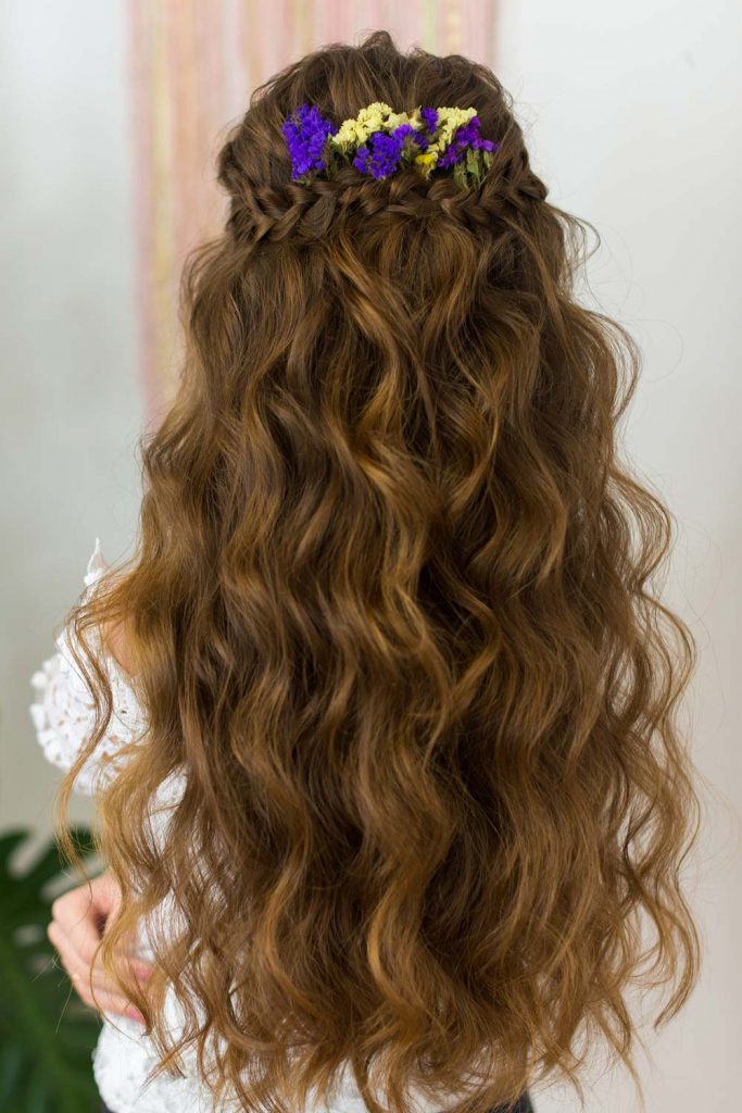 >When it comes to half up half down braid hairstyles, you do not have to reinvent the wheel. You may get away with something easy yet edgy, such as a French braid