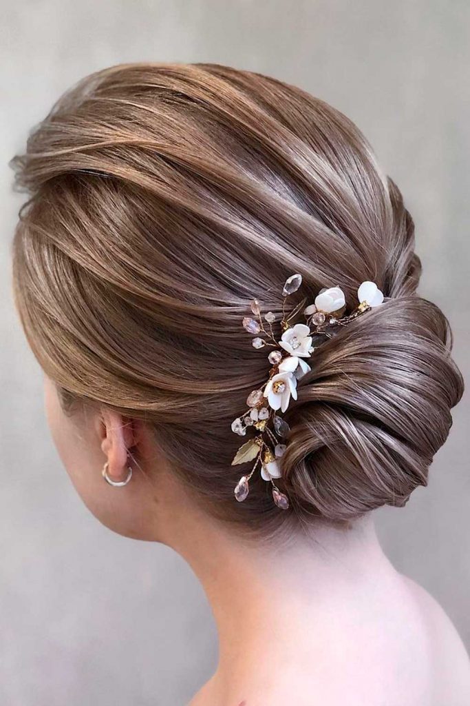 Gentle Swept Back Hairstyle With Floral Accessory