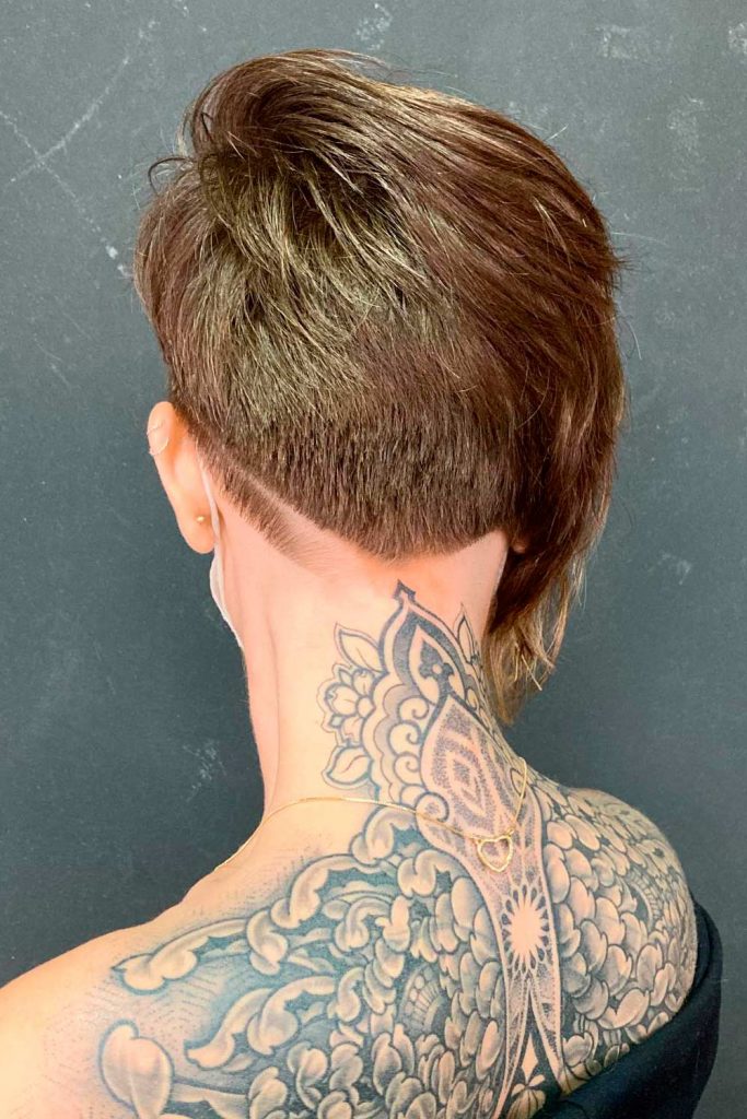It is always a good idea to enhance a pixie short bob with an undercut, especially when it has stacked layers