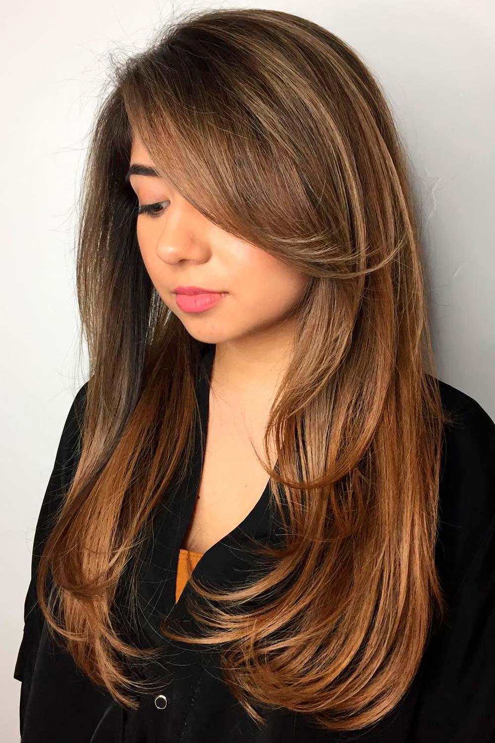 This is one of the popular types of bangs that are swept to the side and covers a certain side of the face
