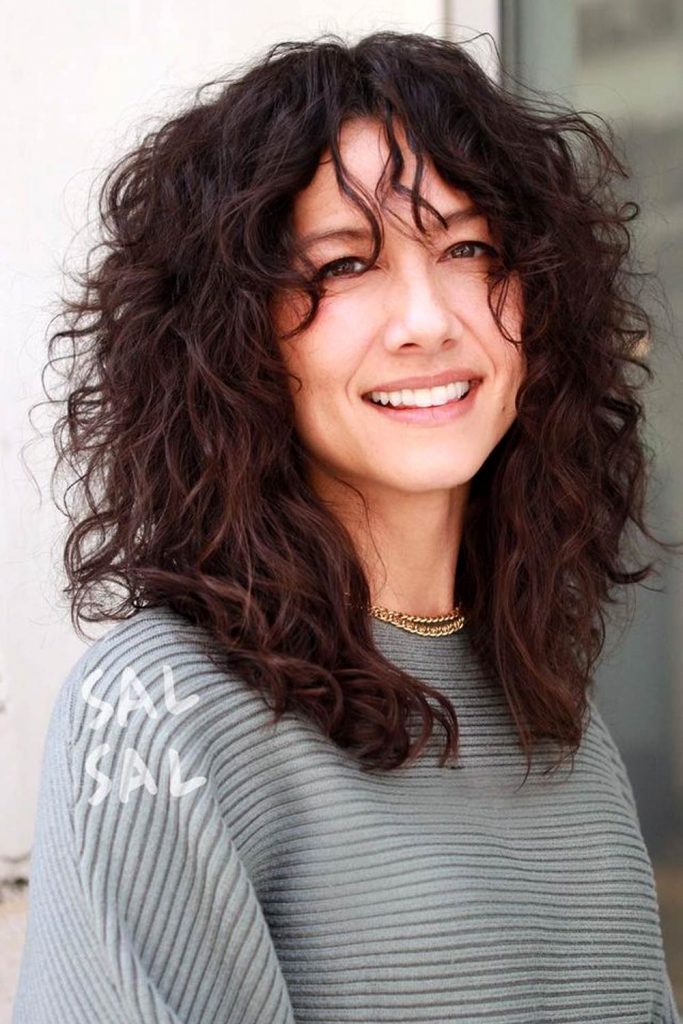 Implement Curly Bangs In Your Outlook and Enjoy The Flattering Effect