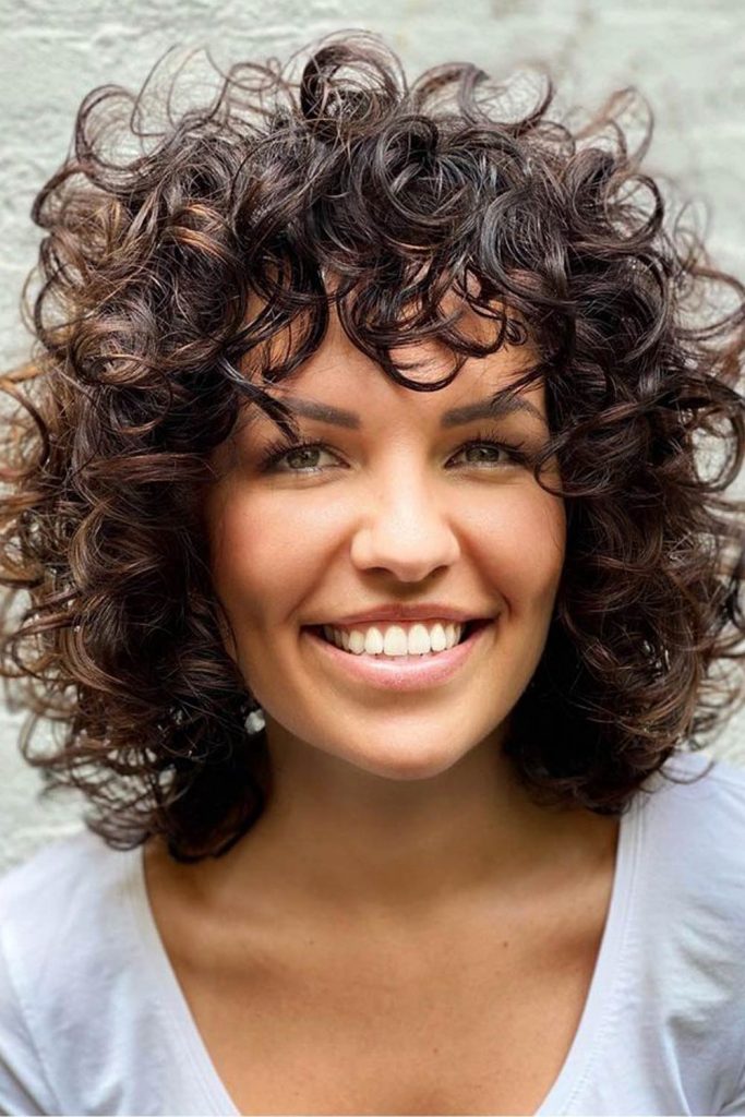 Implement Curly Bangs In Your Outlook and Enjoy The Flattering Effect