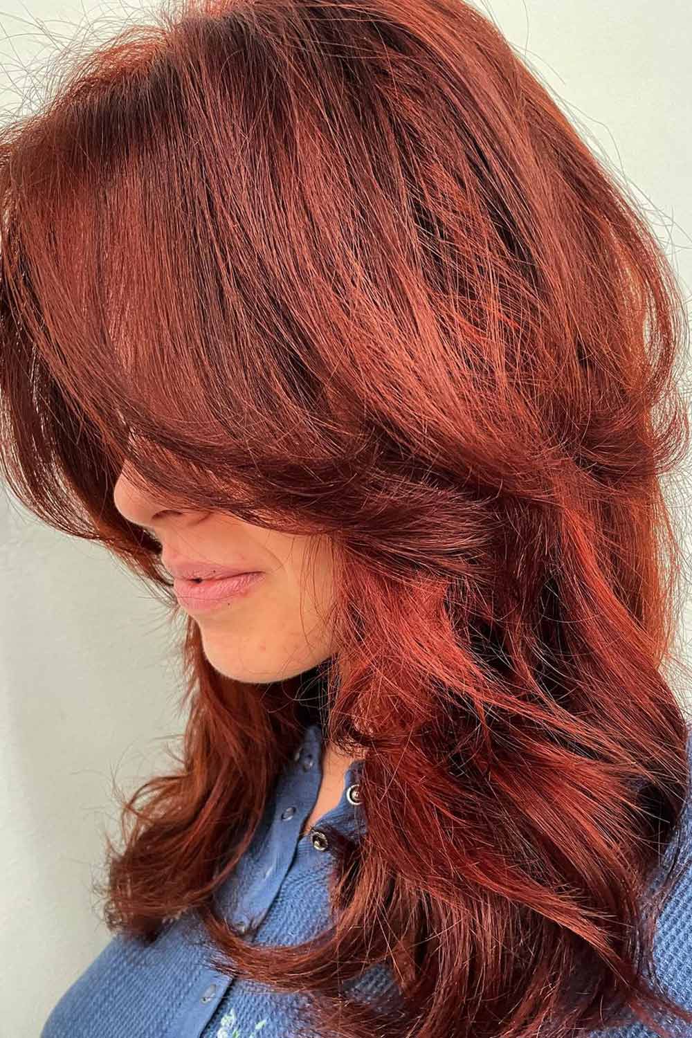Butterfly Haircut With Deep Red Accents