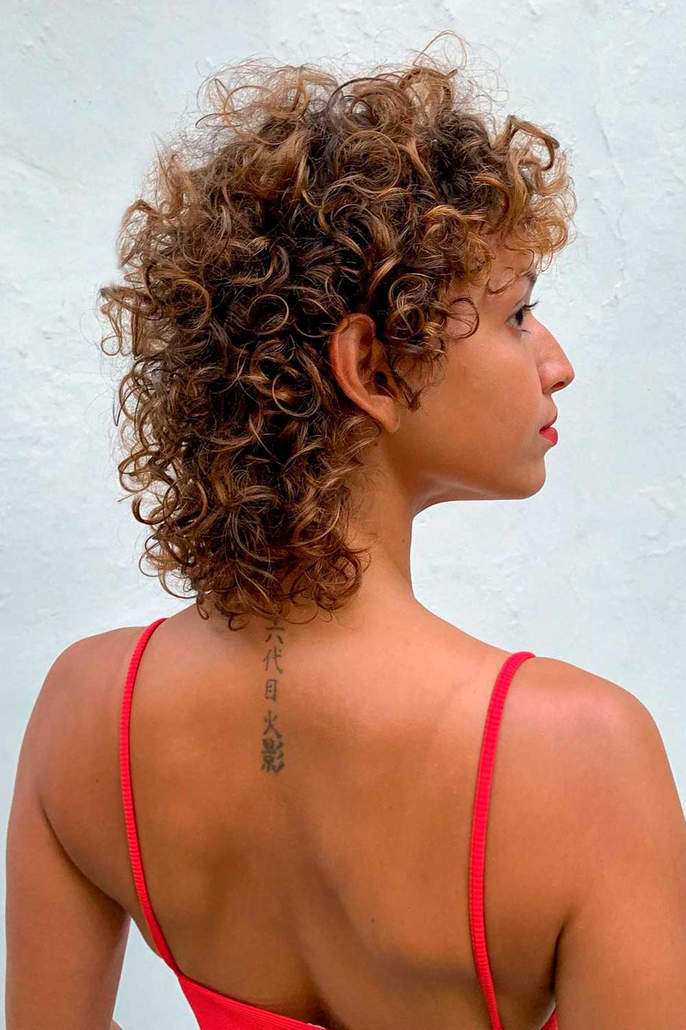 Curly Mullet with Brown Highlights