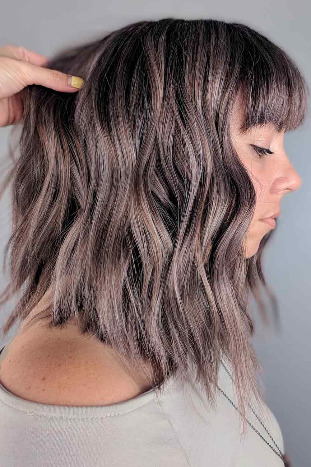 Wavy Lobs With Arched Bangs