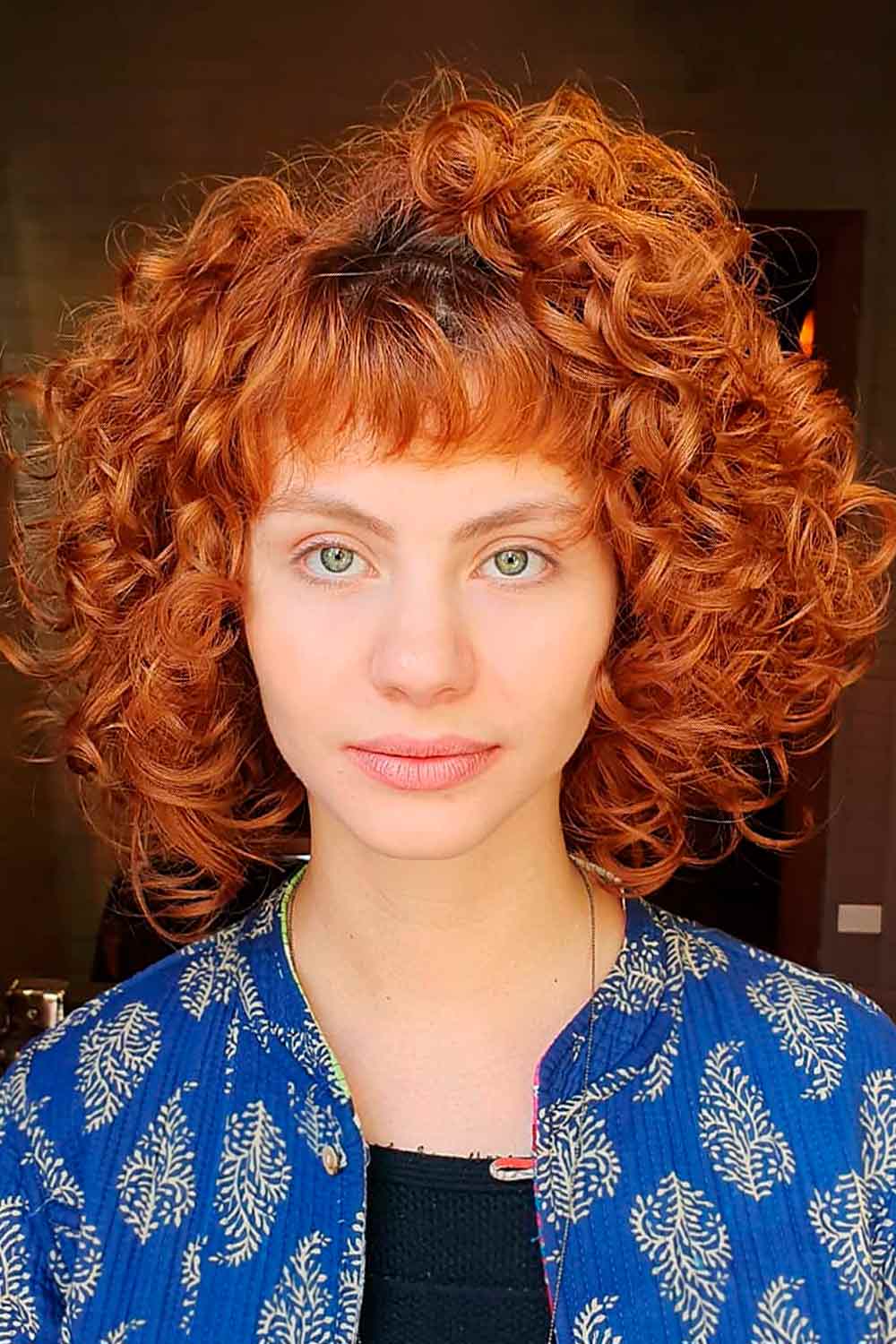 Short Curly Red Bob With Baby Bangs #curlybob #haircuts #bobhaircuts #curlyhairstyles