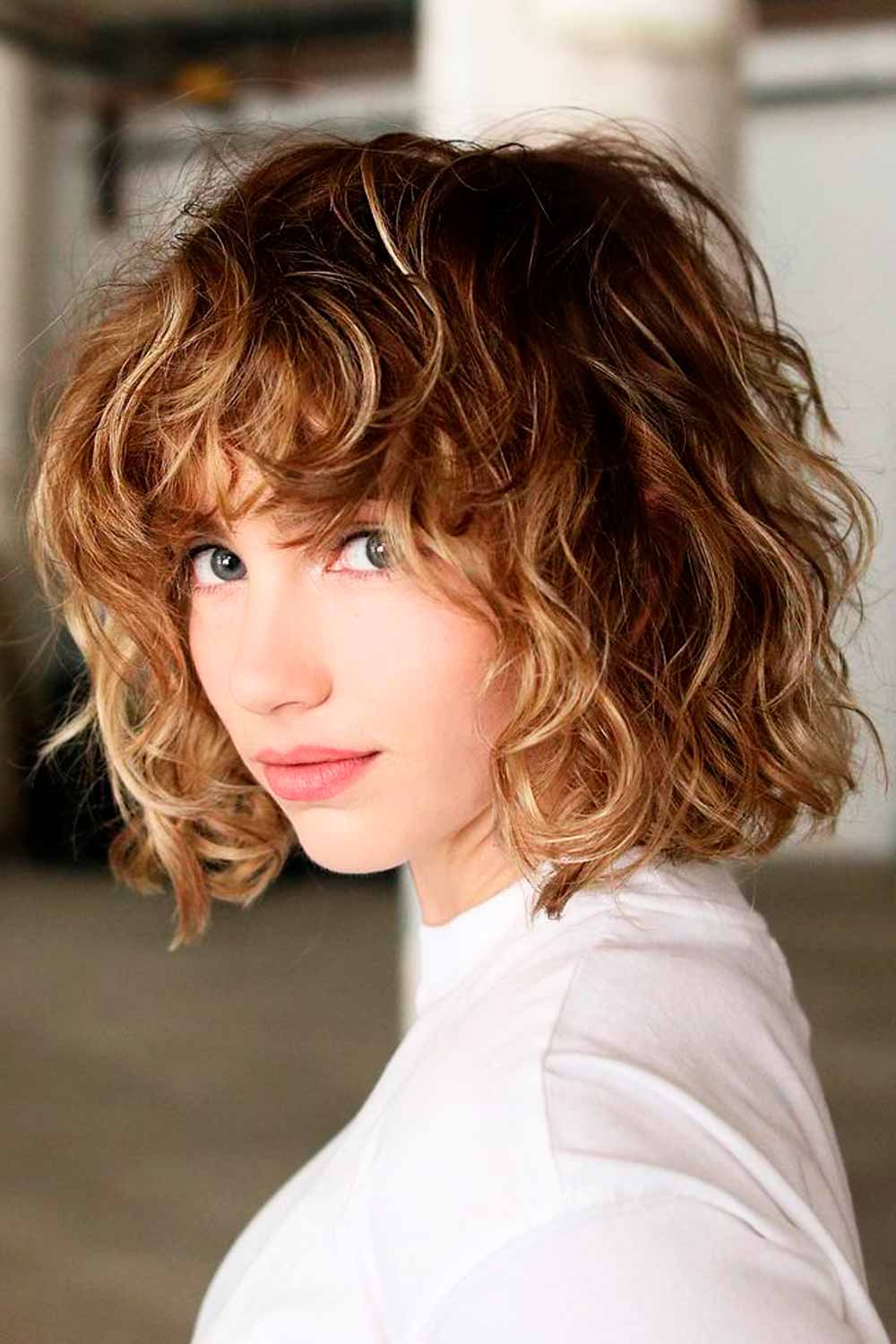 Well-Balanced Rounded Curly Bob With Bangs #curlybob #haircuts #bobhaircuts #curlyhairstyles