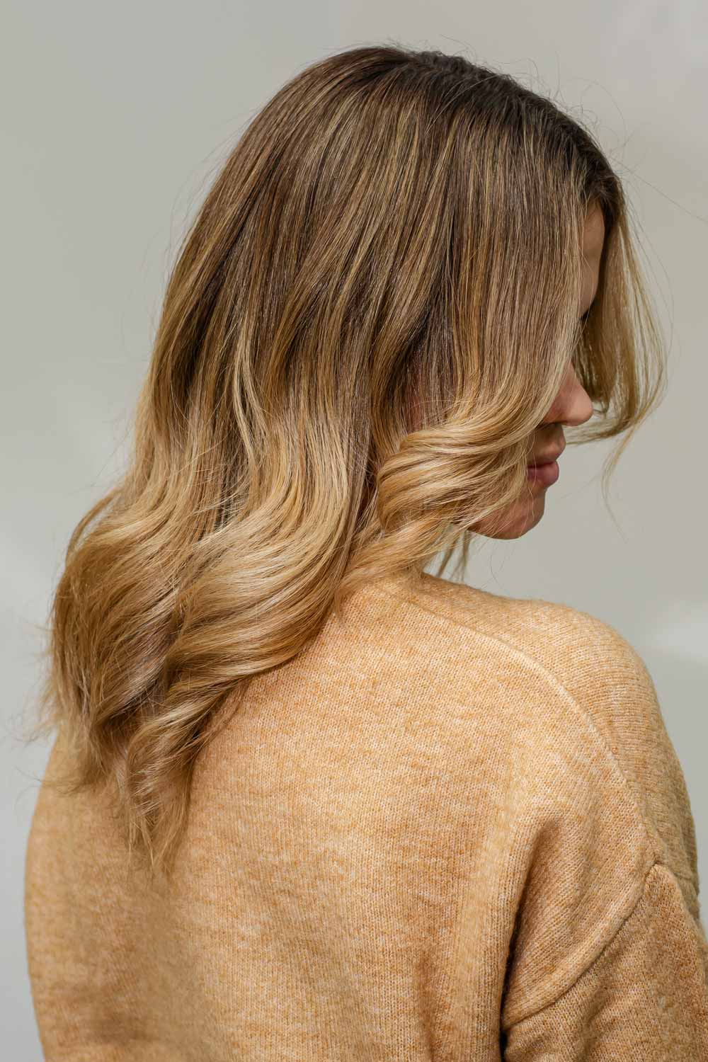 Ombre hair creates a more noticeable contrast between the dark and light colors, resulting in a bolder, more striking appearance