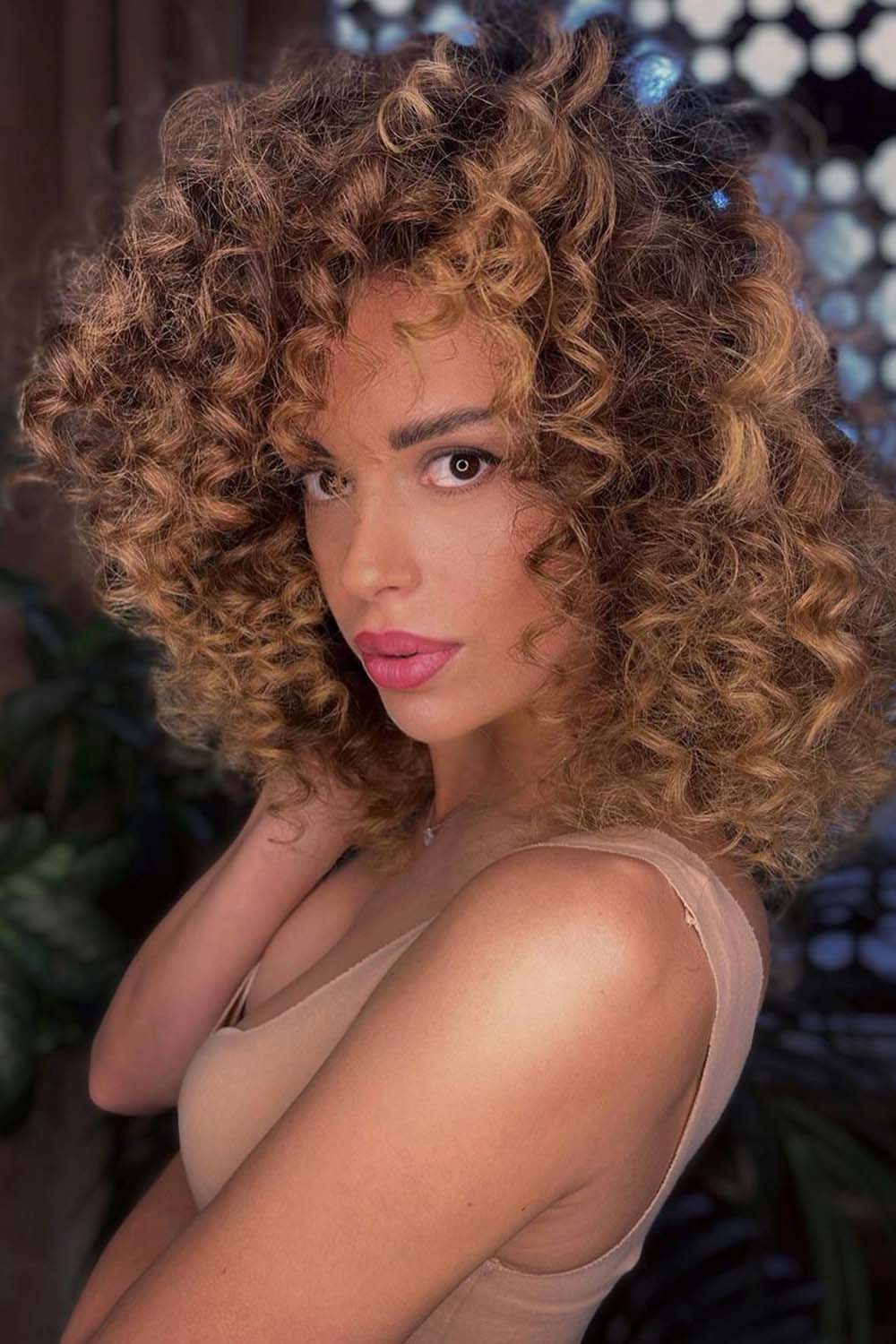 Curly Hair with Caramel Highlights