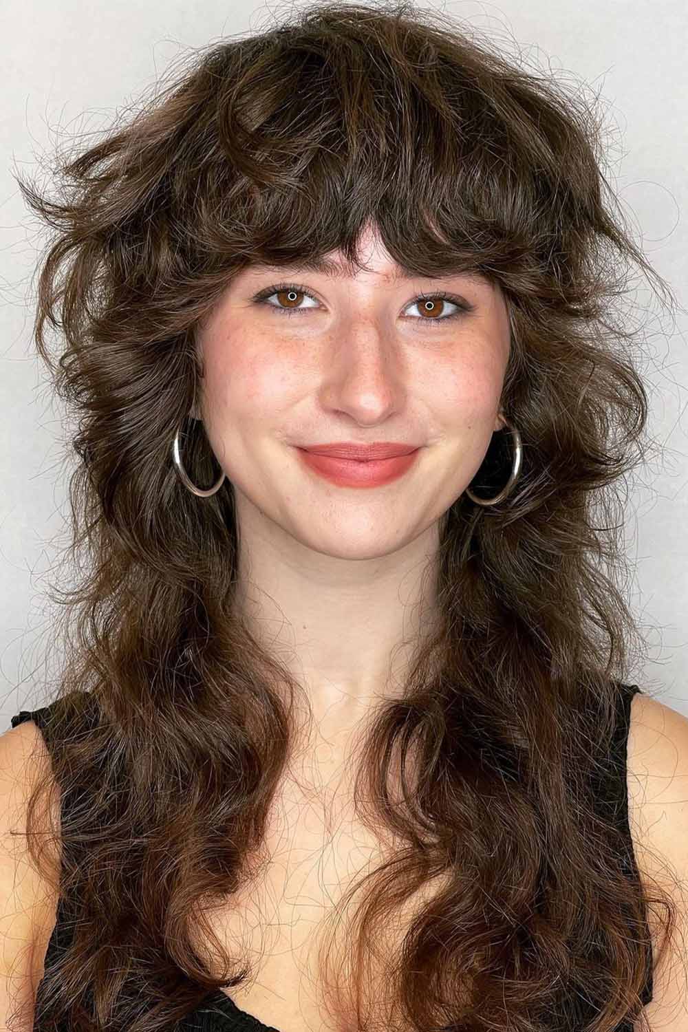 Long Curly Wolf Haircut with Bangs