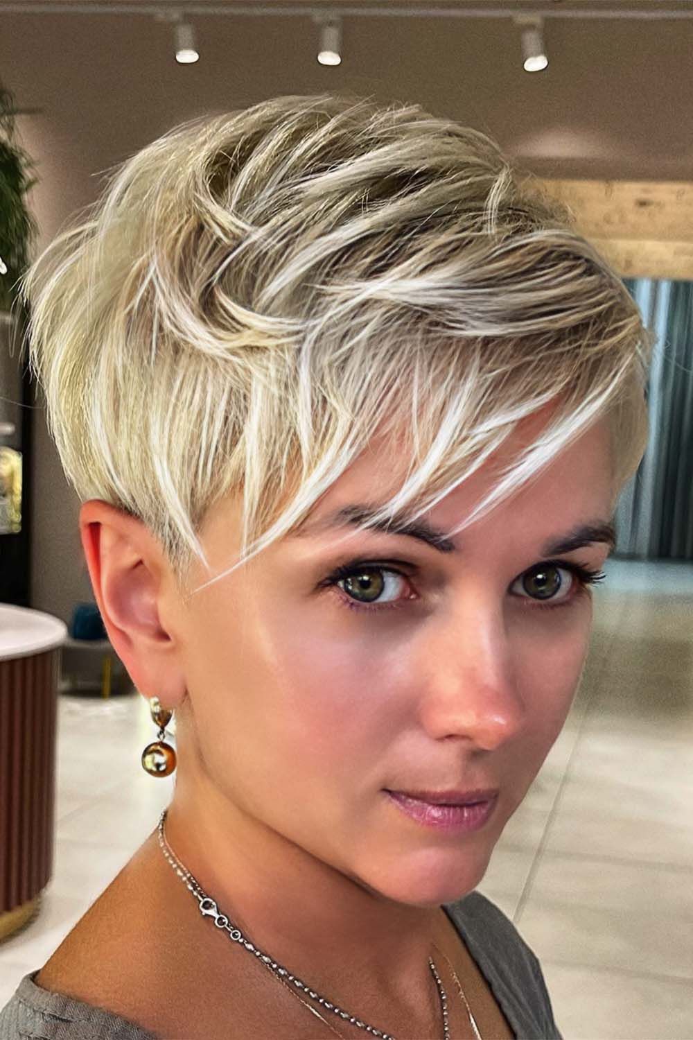 Side Swept Blonde Layered Pixie
