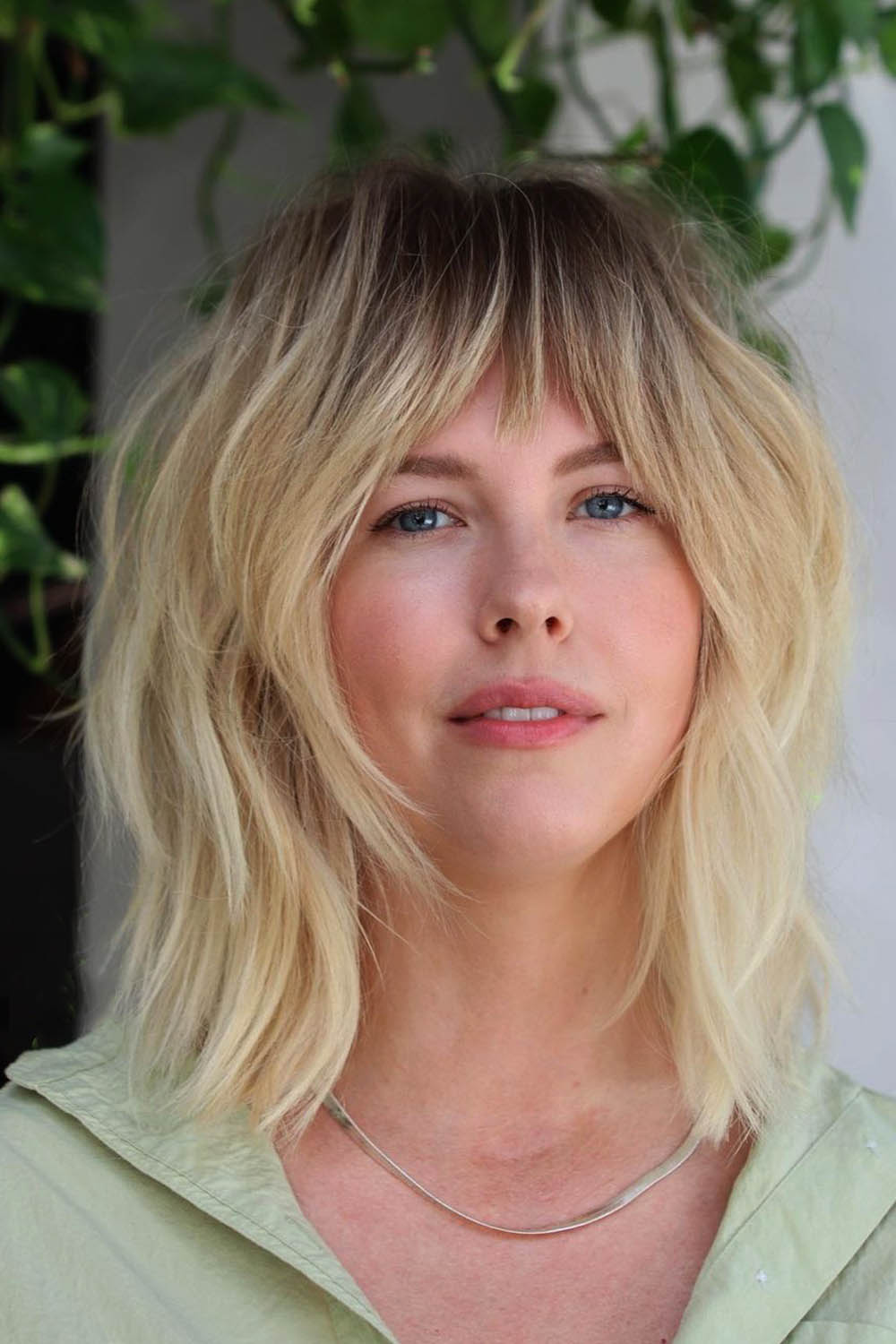 Layered Hairstyle with Bang for Round Face