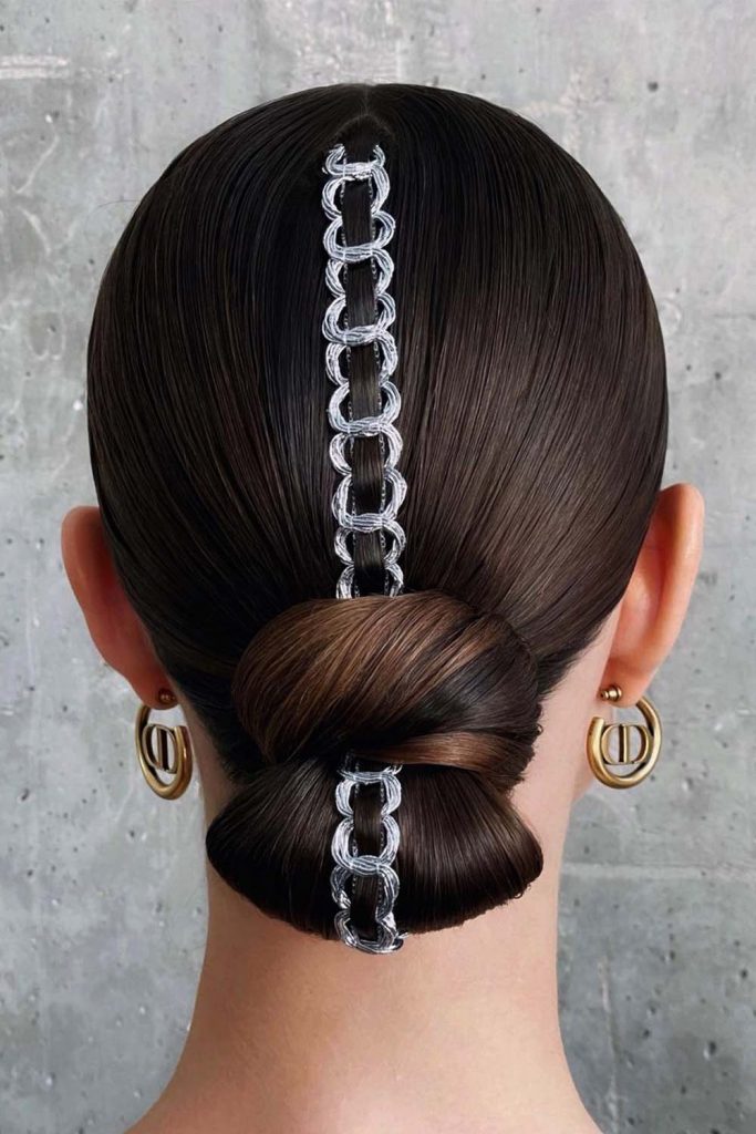 Low Bun Hairstyle with Silver Rings