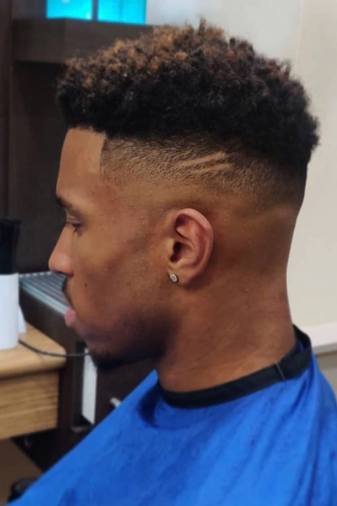 Taper Fade Black Men Haircut with Curly Top