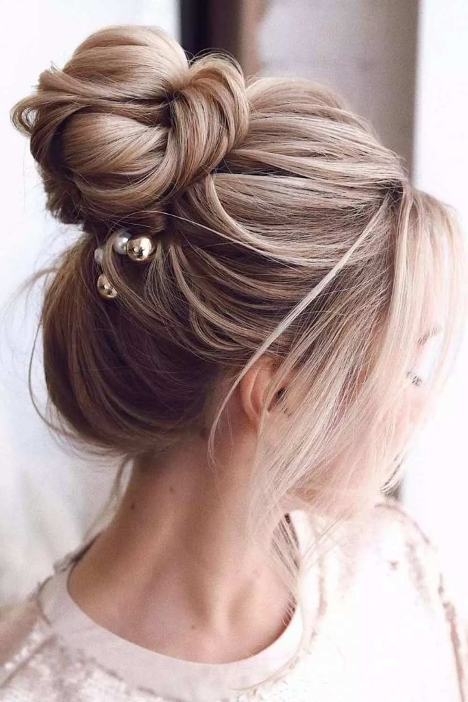 High Bun Center Parted Hairstyles With Bangs 